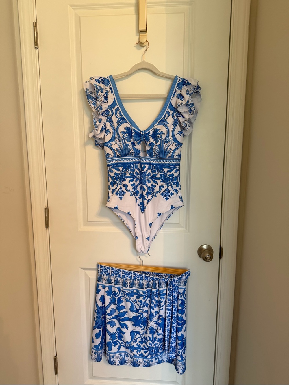Set. Blue and White Floral One-Piece Swimsuit with Matching Skirt